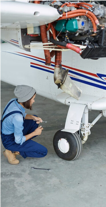 Engineer working with airplane