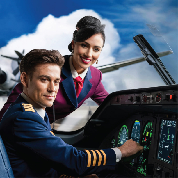 Pilot and air hostess posing together